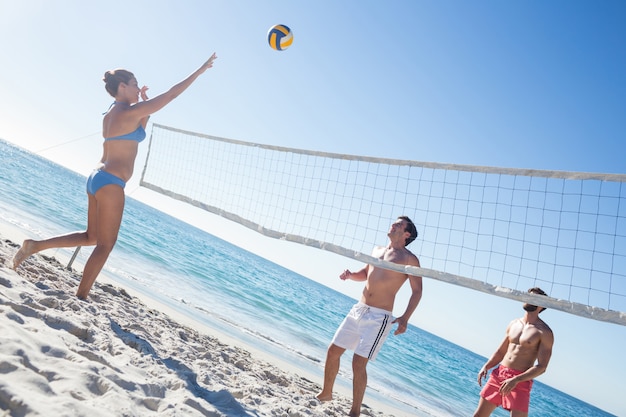 Friends playing volleyball