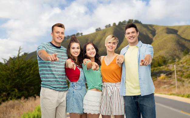 Photo friends pointing at you over big sur hills