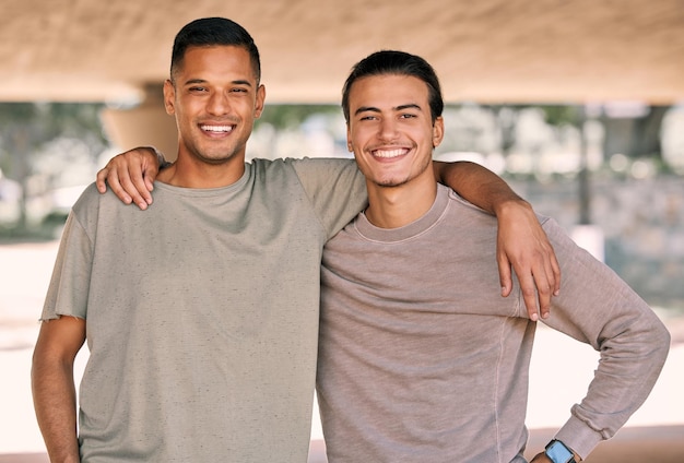 Friends portrait and men with smile outdoor relax together and happy with diversity hug and freedom Friendship care and bonding with solidarity support and young people with bond and trust