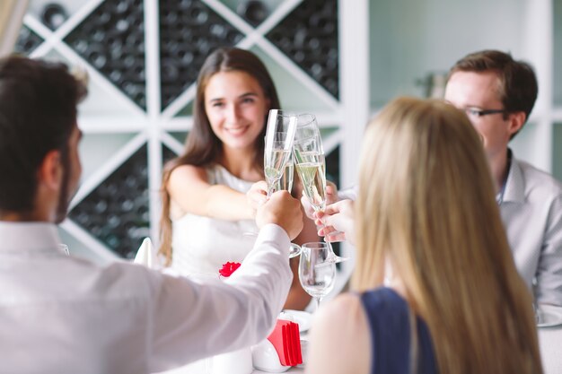 Friends in restaurant having a toast