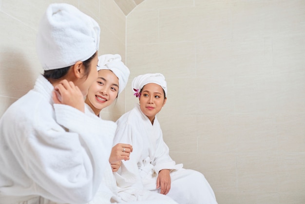 Friends resting in spa salon