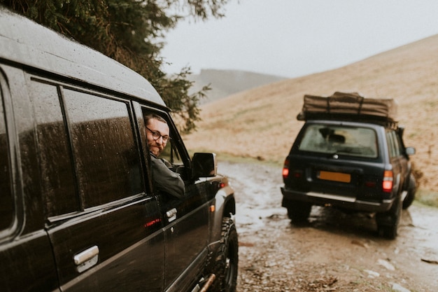 Friends on the road driving through a rugged terrain