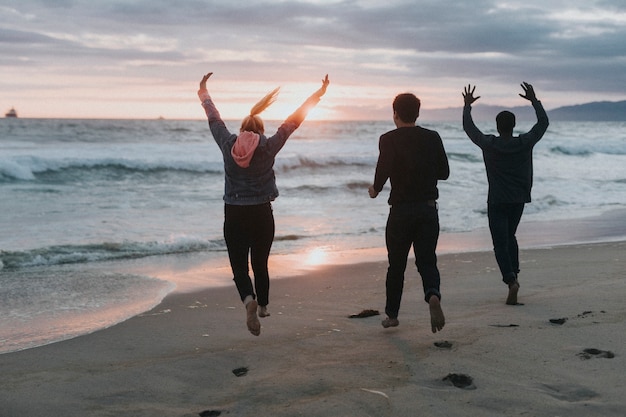 Friends running on the beach