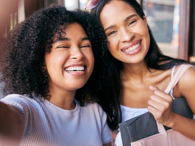 Friends selfie and shopping date with black women smile and happiness together with retail sale and discount at shopping mall Portrait happy in photograph and freedom customer and shop outdoor