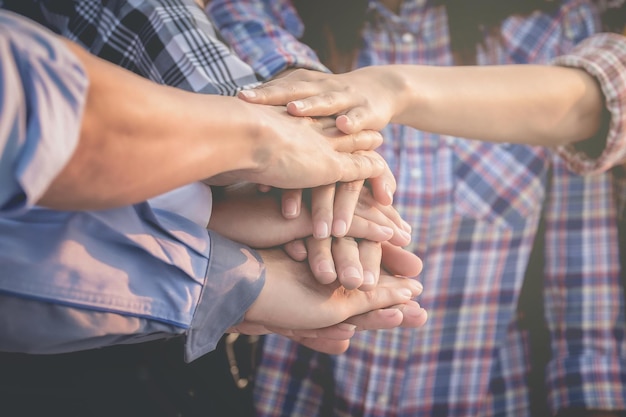 Photo friends stacking hands