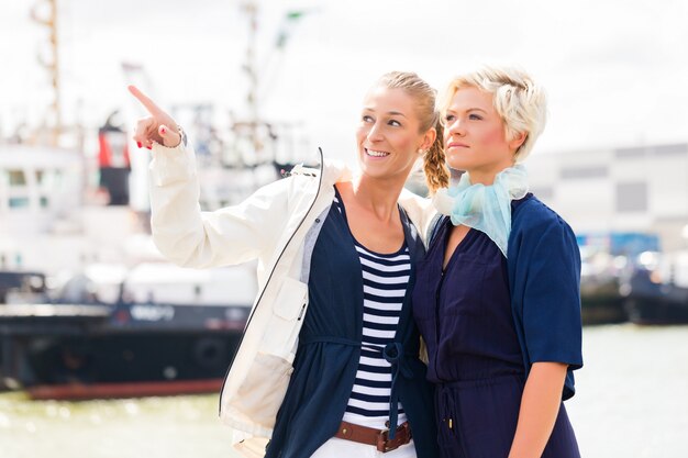 Friends standing at Harbor pier 