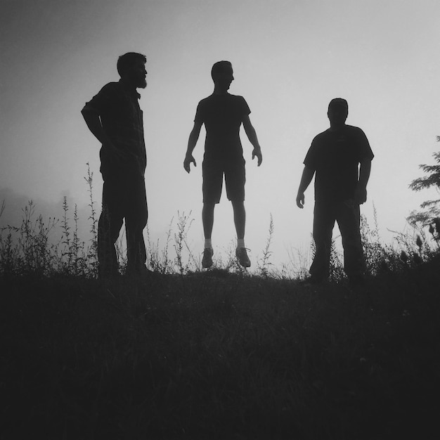 Friends standing on white background