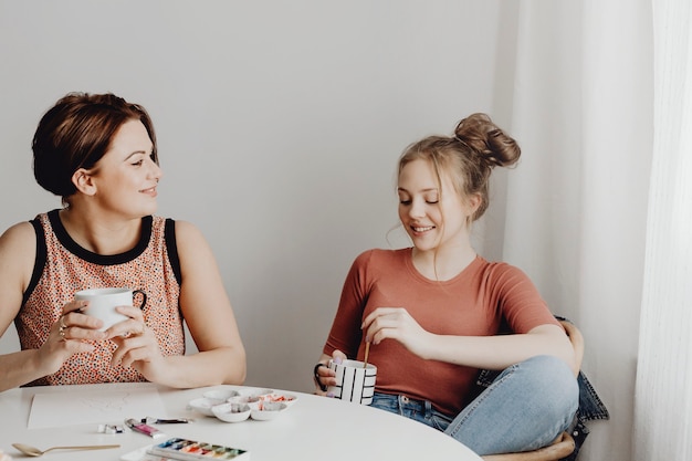 Friends taking a break from painting