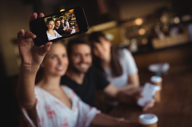 Friends taking a selfie on mobile phone