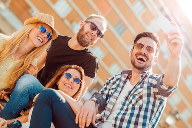 Friends taking selfie outdoors