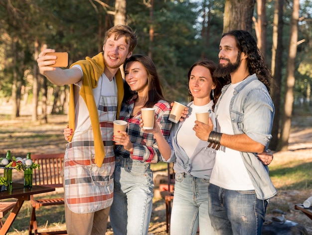 Friends taking a selfie while outdoors having fun