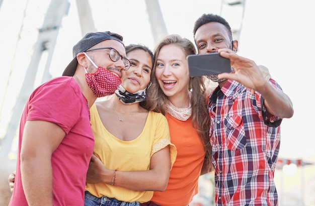 friends taking selfie with face mask