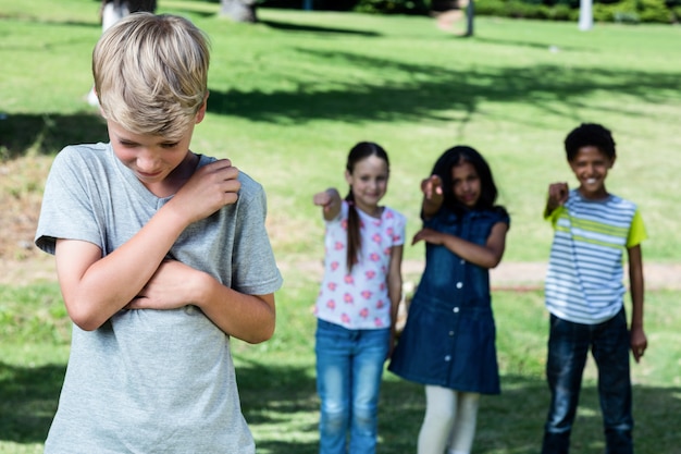 Friends teasing a boy