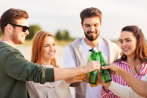 friends toasting non alcoholic drinks on beach