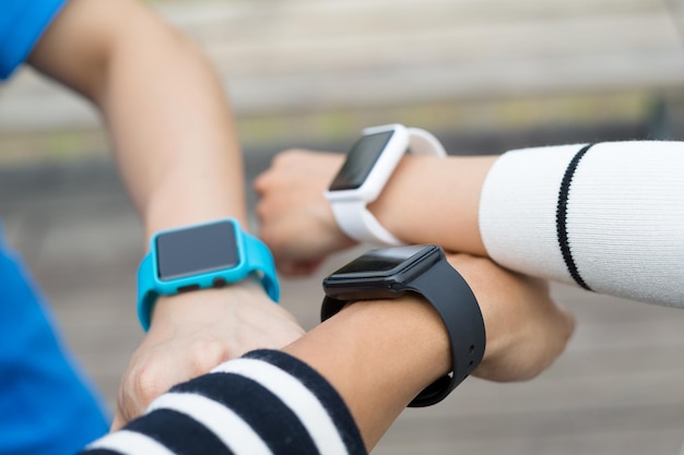 Friends using smart watch together