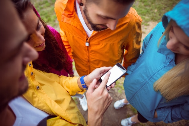 Friends using a smartphone on hike