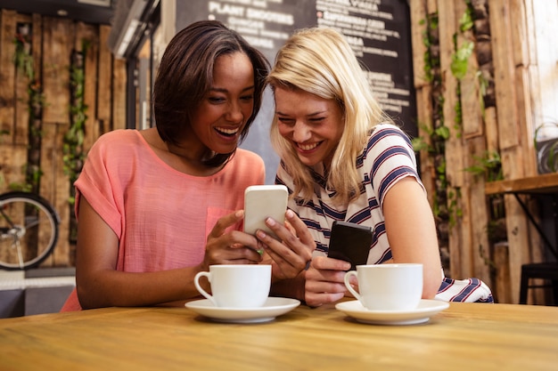 Friends using smartphones