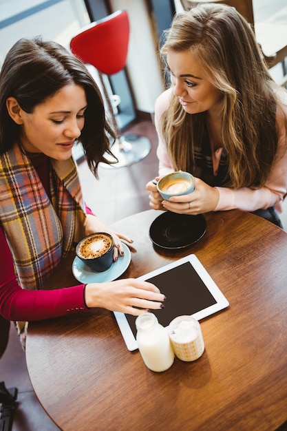 Friends using tablet together