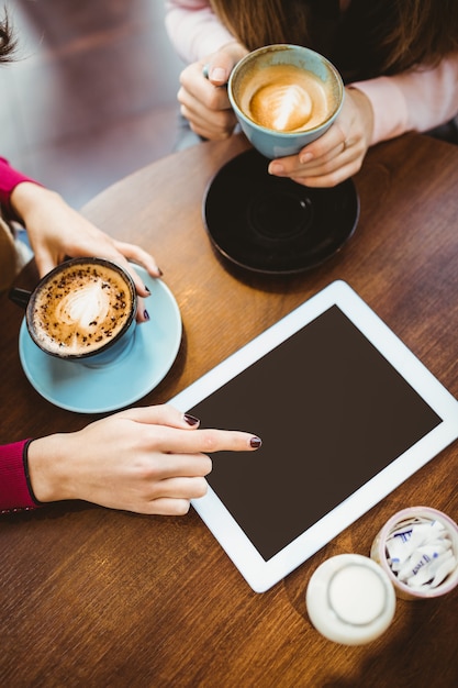 Friends using tablet together