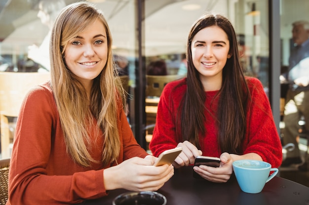 Friends using their smartphone