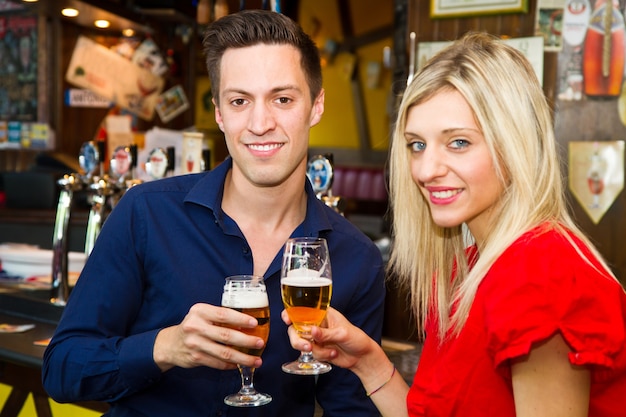 Friends with beer  in a pub