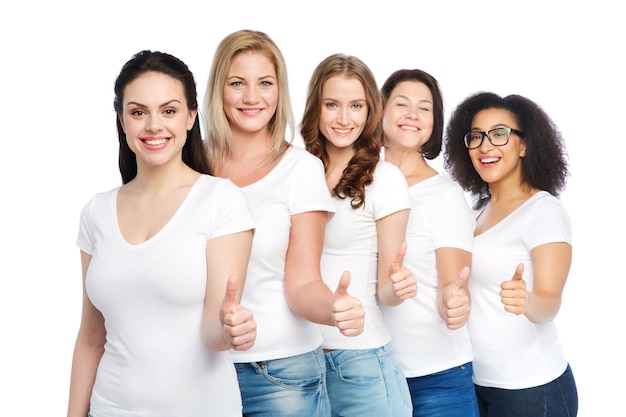 friendship, diverse, body positive, gesture and people concept - group of happy different size women in white t-shirts showing thumbs up