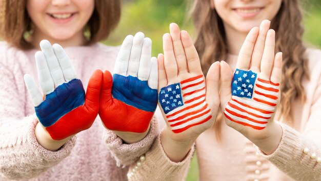 Friendship of peoples exchange of students learning foreign languages child hands painted in america