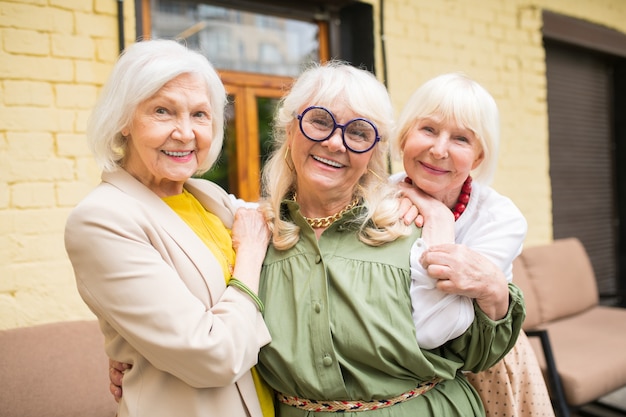 Photo friendship. three ssweet senior ladies looking happy spedning time together