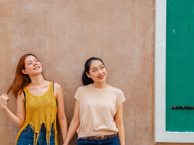 Friendship of two woman standing outdoor.