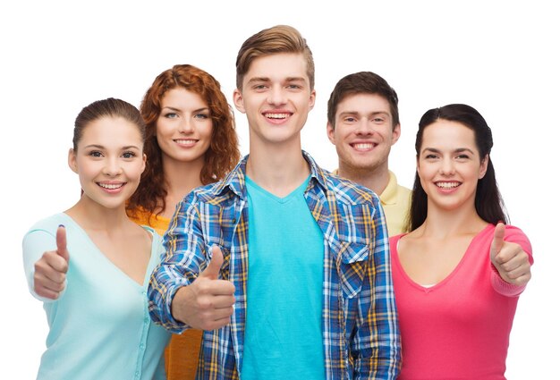 friendship, youth and people concept - group of smiling teenagers showing thumbs up