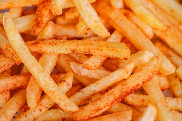 Foto fries aardappelsticks in bulk close-up selectieve focus