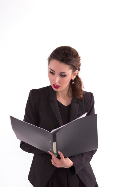 Frightened business woman looking at documents in the folder