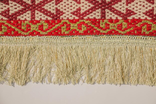 Fringe on the edge of the carpet closeup