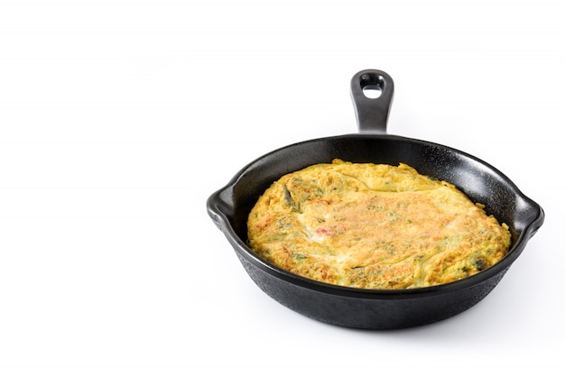 Frittata made of eggs and vegetables in a iron pan