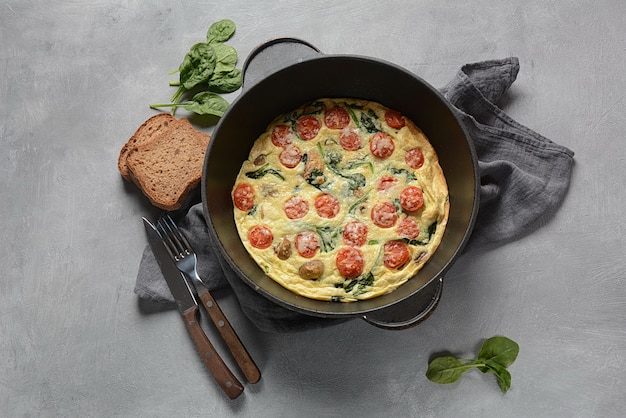 Frittata with eggs, mushrooms and cherry tomatoes