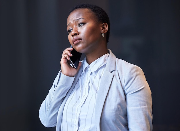 from fear can come courage shot of a young woman using her phone at work
