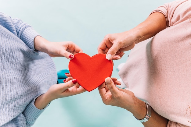 From above women holding heart