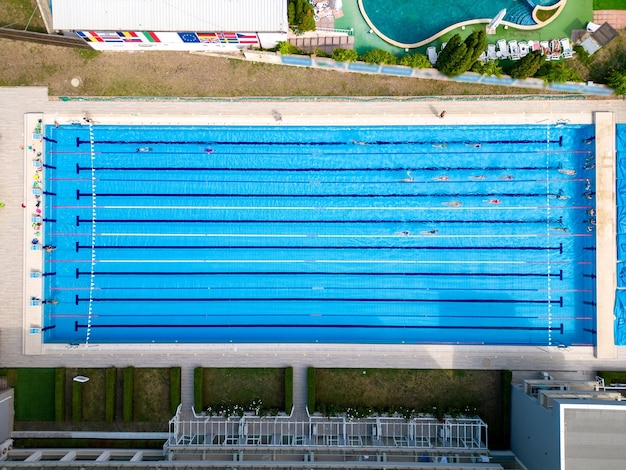 From above you can see a group of swimmers training in a sports pool Aerial view