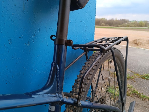 The front of a blue bike with the word bike on it