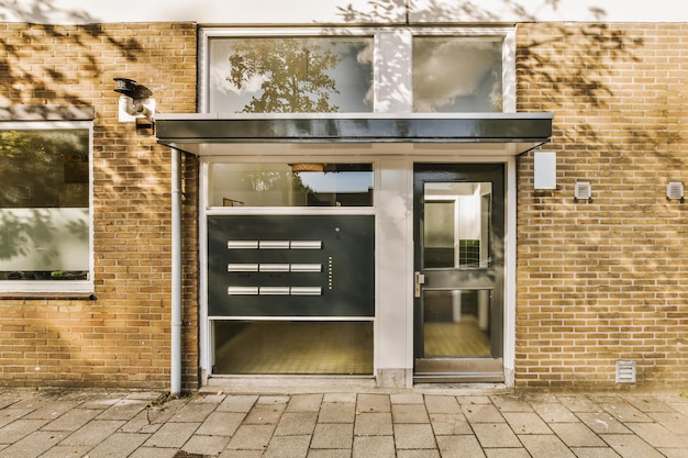 The front of a brick building with a black door