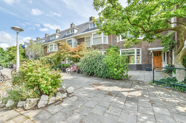 The front of a brick house with a brick driveway