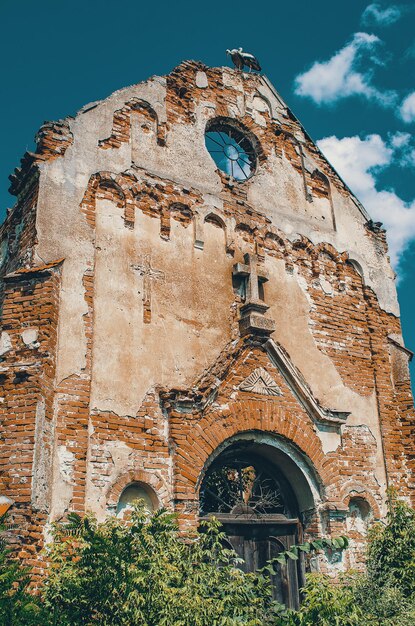 Photo the front brick wall of the ruined church