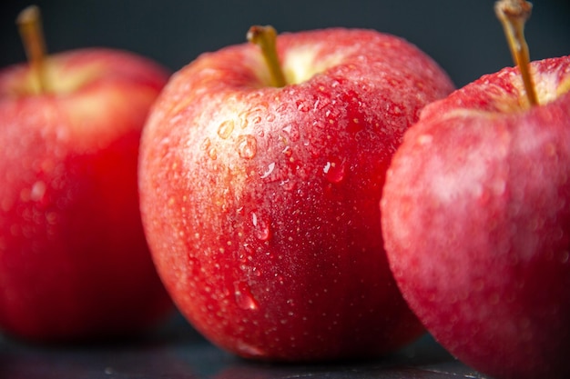 Front close view fresh red apples on dark background color mellow ripe vitamine apple pear juice tree food diet