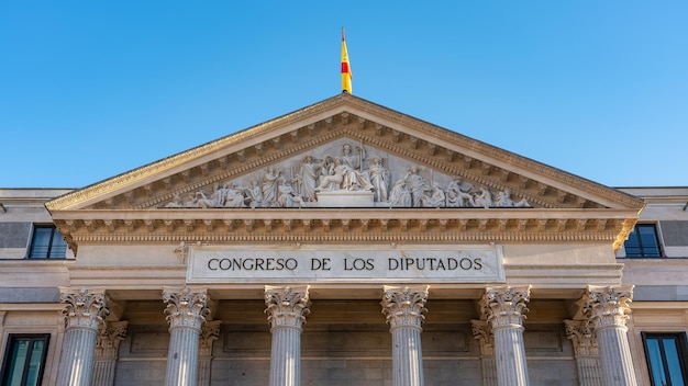 Front of the Congress of Deputies with the Spanish flag in the city of Madrid