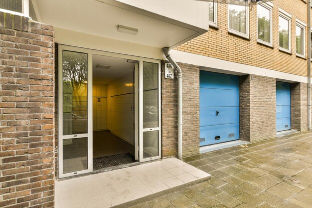 front door of a brick house with blue doors