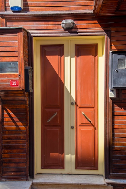 The front door is brown wood in the old style