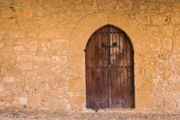 A front entrance of a historic building with a door.