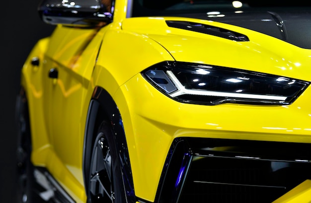 Front headlights of modern yellow car