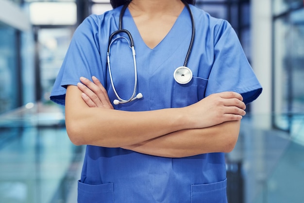 The front line of healthcare Portrait of a young female doctor standing with her arms crossed in a hospital