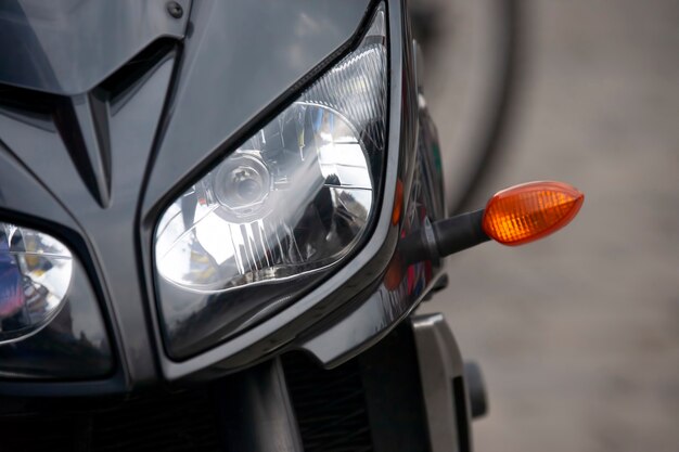 Front of a modern motorcycle with headlight.